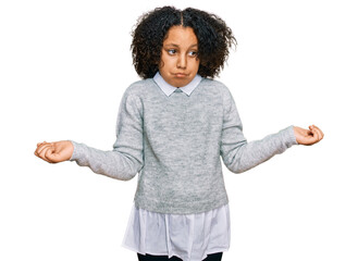 Young little girl with afro hair wearing casual clothes clueless and confused expression with arms and hands raised. doubt concept.