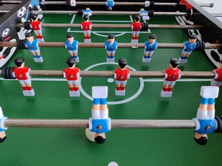 Arcade table soccer with tools for playing for office and home games.