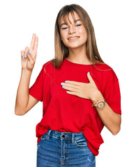 Teenager caucasian girl wearing casual red t shirt smiling swearing with hand on chest and fingers...