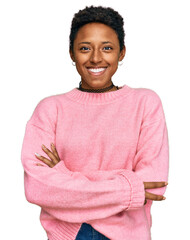 Young african american woman wearing casual clothes happy face smiling with crossed arms looking at...