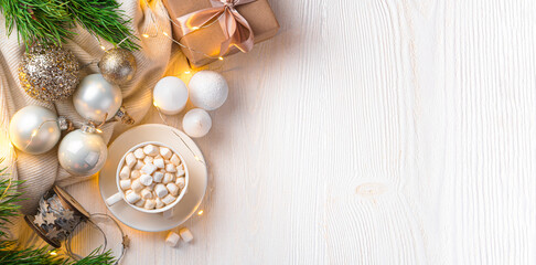 Fototapeta na wymiar Christmas composition with coffee with marshmallows, gifts and Christmas decorations on a light background. Top view, copy space