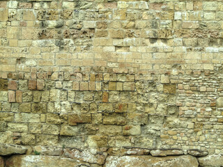 Castle wall made from old stones textures for design and photo