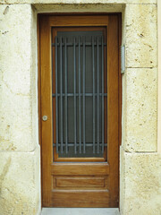 Old vintage wooden rustic door on rural home wall