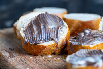baguette with sweet chocolate butter on a board
