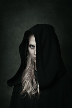 Dark woman with black hood