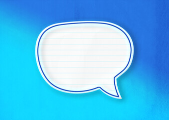 Blank white speech bubble isolated on blue background.