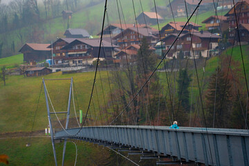 Sigriswil , Panorama , suspension bridge over the Gummi Gorge near Lake Thun during autumn winter...