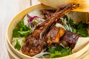 grilled lamb ribs with fresh vegetables and lavash