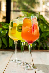 fresh lemonades from different fruits in a glass