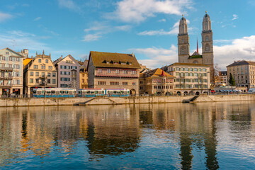 Grossmunster , and cityscape from Munster Bridge , along Limmat river during autumn , winter : Zurich , Switzerland : December 6 , 2019