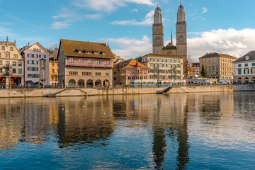 Grossmunster , and cityscape from Munster Bridge , along Limmat river during autumn , winter : Zurich , Switzerland : December 6 , 2019
