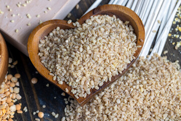 Fresh uncooked bulgur porridge on the table
