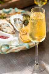 open and closed oyster with sauce and lemon