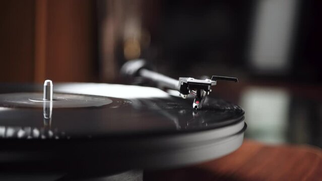 vintage vinyl record player. on a wooden table. close-up.