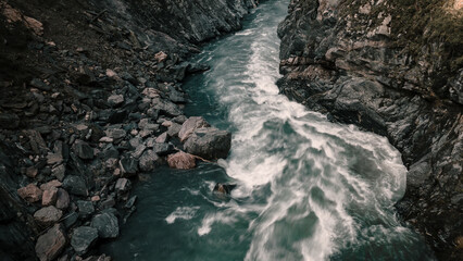 Beautiful mountain river in the canyon. Fast current. Beautiful nature and forests. Trees grow on the mountains.