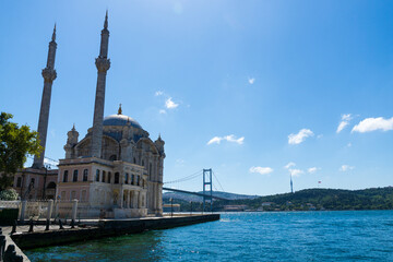 Ortakoy Mosque in Istanbul with the bosphorus bridge on a sunny day