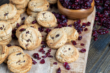 delicious dried cookies made of high-quality flour with dried red cranberries on the table