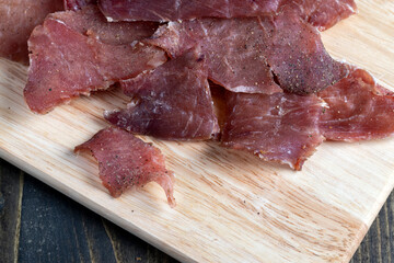 thin pieces of dried meat with spices