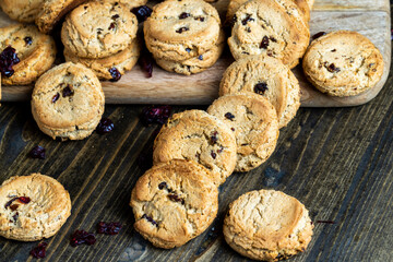 delicious dried cookies made of high-quality flour with dried red cranberries on the table