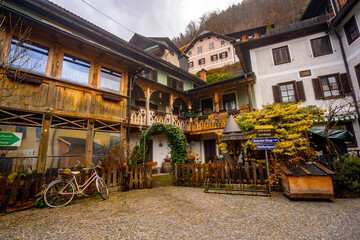 Hallstatt  , Unesco Romance town at Lake Hallstatt and Salzkammergut  during winter cloudy day : Hallstatt , Austria : December 10 , 2019