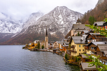 Fototapeta premium Panoramic classic view at Hallstatt , Unesco Romance town at Lake Hallstatt and Salzkammergut during winter cloudy day : Hallstatt , Austria : December 10 , 2019