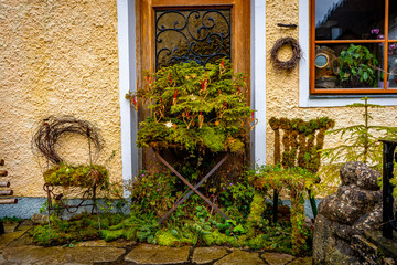 Fototapeta na wymiar Colourful houses and decorate buildings in Hallstatt , Romance town at Lake Hallstatt during winter cloudy day : Hallstatt , Austria : December 10 , 2019