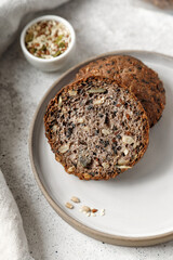 Whole grain bread with seeds, sliced wholemeal bread cut. Healthy nutrition, bio organic food.