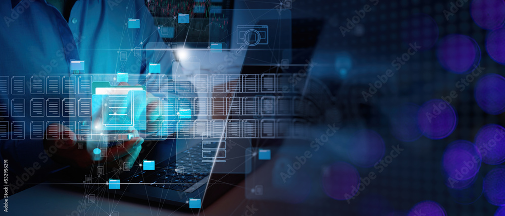 Poster ERP, document management concept.Businessman working with smart phone and laptop computer with icons on virtual screen and office blur background.