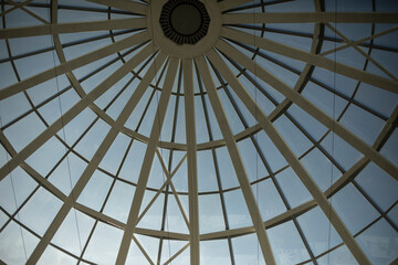 Dome roof made of glass and fittings. Steel beams form circle.