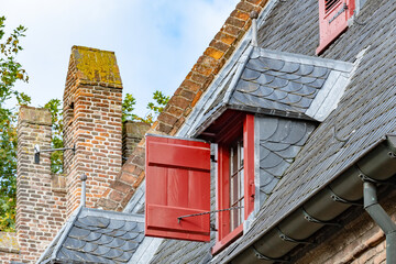 red brick building with windows and roof