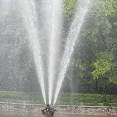 Fountain in the complex of Lodhi Garden in Delhi India, working fountain in the Lodhi Garden complex, water in the fountain, fountain in the Lodhi Garden park during morning time