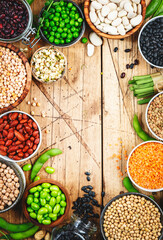 Legumes, beans and sprouts. Dried, raw and fresh, top view. Lentils, mung beans, chickpeas, soybeans, edamame, peas, Healthy diet food, vegan protein, micronutrients and fiber sources