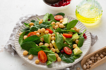 Close up of Vegan salad with chick-pea avocado spinach  healthy food