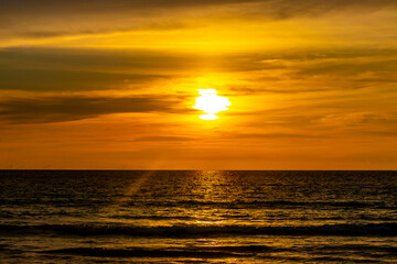 Fototapeta na wymiar Beautiful stunning colorful and golden sunset at Phuket island Thailand.