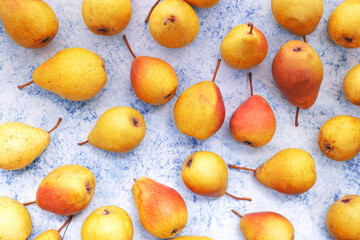 Beautiful juicy pears on a blue background