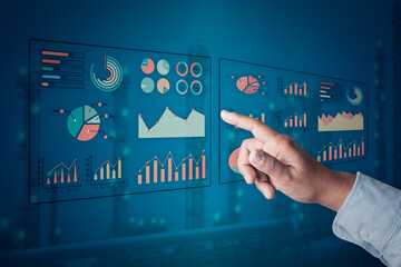 businessman hand point in virtual interface dashboard statistic chart on digital screen to plan or analyze company's profit or business strategy for future technology system. Hand pointing dashboard.