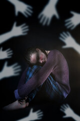 hands shadows over a crying and scared little girl