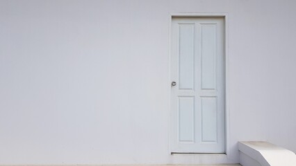 white door on white wall.