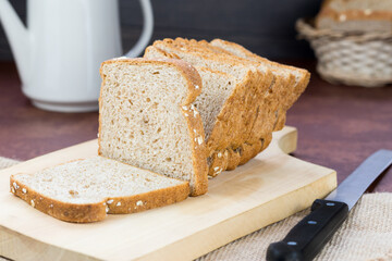 meal organic whole grain sliced ​​bread with oats on dining room