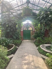 Kuningan, Indonesia - May 2, 2022: the entrance gate to the sacred tomb of Sheikh Rama Haji Irengan, at the Darma Loka religious tourist site, Kuningan. Grainy effect concept