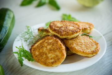 fried vegetable pancakes from squash and zucchini with herbs