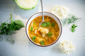 vegetable summer soup with cauliflower in a bowl