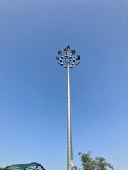 street light lamppost on a blue sky. daytime streetlight. lantern street lighting against day time sky. street lamp on metal pole. lamp street lighting is off. park lantern. old lamp city lighting