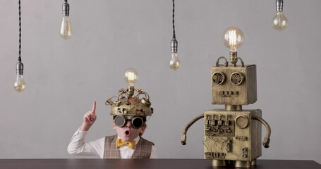 Happy child have bright idea. Funny kid with robot. Success, creative and innovation technology concept. Slow motion