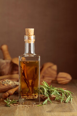 Bottle of olive oil with rosemary and spices.