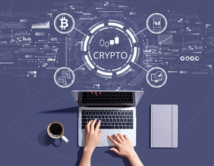 Fototapeta na wymiar Crypto Trading theme with person using a laptop computer