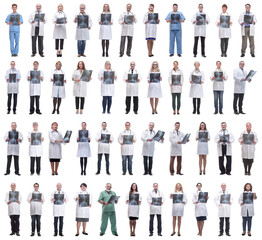 group of doctors holding x-ray isolated on white