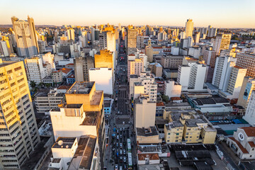 Central region of the City of Campinas with buildings, avenues and cars in the early evening....