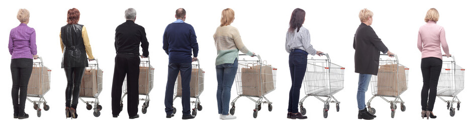 a group of people with a cart stand with their backs isolated