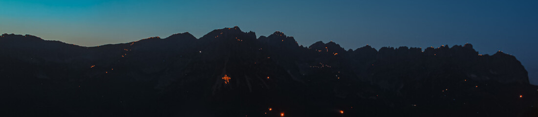 Summer solstice mountain fires 2022 at the famous Hartkaiser summit, Ellmau, Wilder Kaiser, Tyrol,...